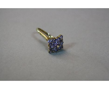 A 10K TANZANITE CLUSTER RING, ring size T, approximate weight 4.5 grams