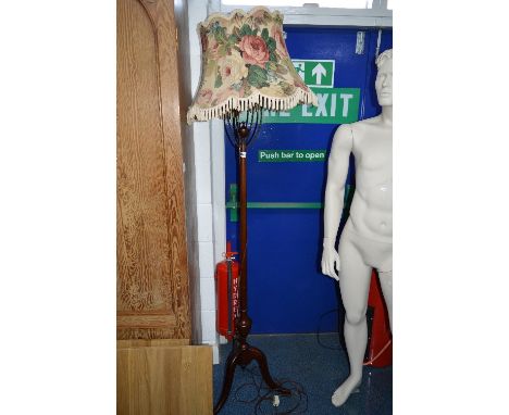 A MAHOGANY STANDARD LAMP, on a tripod support with shade