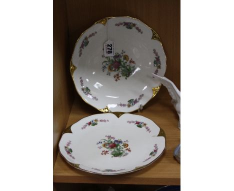 TWO ROYAL WORCESTER PLATES, florally decorated with trim, black backstamp, diameters 21.5cm (2)