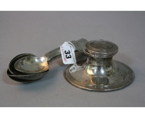 A SILVER CAPSTAN INKWELL, with five spoons