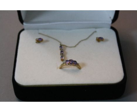 A 9CT TANZANITE JEWELLERY SUITE, to include ring, ring size O, pendant and a pair of earrings