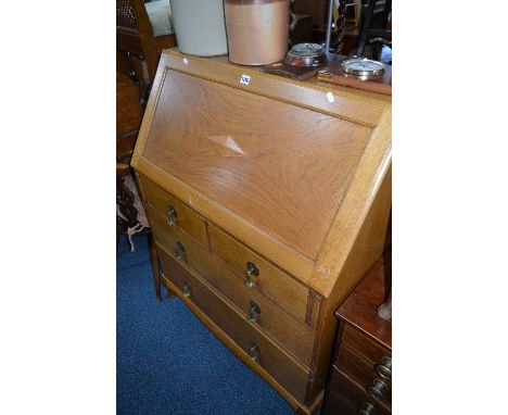 A LIGHT OAK FALL FRONT WRITING BUREAU, with fitted interior containing ten various drawers above four exterior drawers, appro