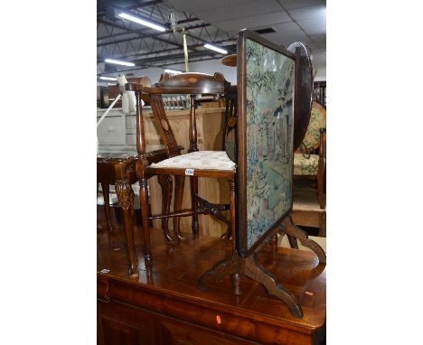 AN EDWARDIAN MAHOGANY AND INLAID CORNER CHAIR, and an oak firescreen/occasional table with needlework detail (2)
