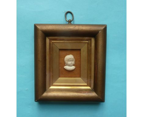 1841 Birth of Prince of Wales: a rare framed and glazed cast portrait of the infant on a velvet ground, the reverse affixed w