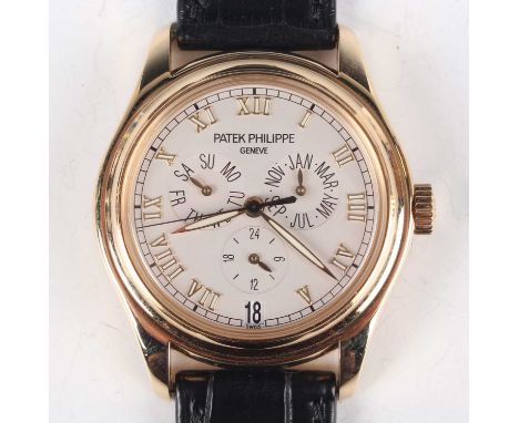 A Patek Philippe Genève 18ct gold cased gentleman's calendar wristwatch, Ref. 5035J, the signed and jewelled automatic 315/19