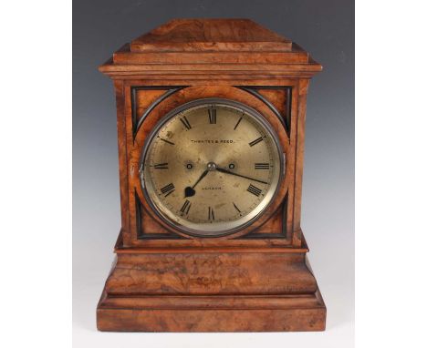 A Victorian walnut bracket clock with eight day twin fusee movement striking on two bells, the 8-inch silvered dial with blac