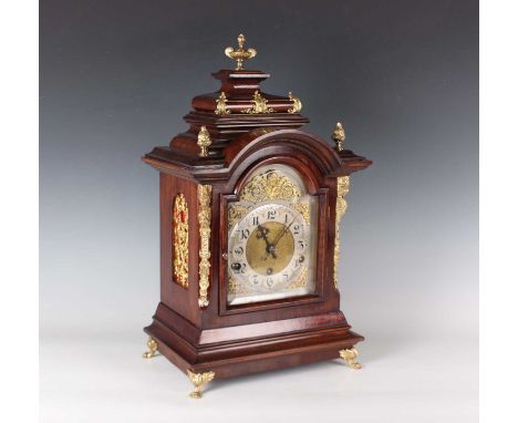 A late 19th century German gilt brass mounted walnut mantel clock with eight day movement chiming on gongs, the 6-inch silver