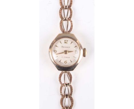 A Regency 9ct gold cased lady's bracelet wristwatch, the signed circular dial with gilt Arabic numerals and arrow shaped hour