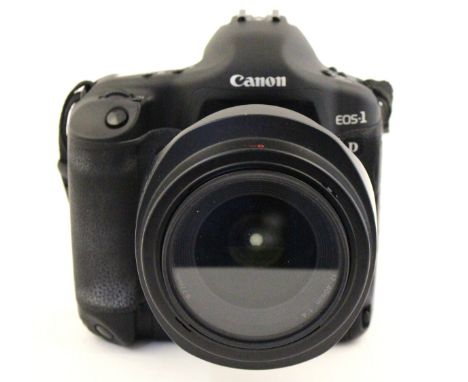 Canon: A Canon EOS 1D Mark II camera body, with Canon EF 17-40mm 1:4 L lens within Lowepro camera case, boxed.
