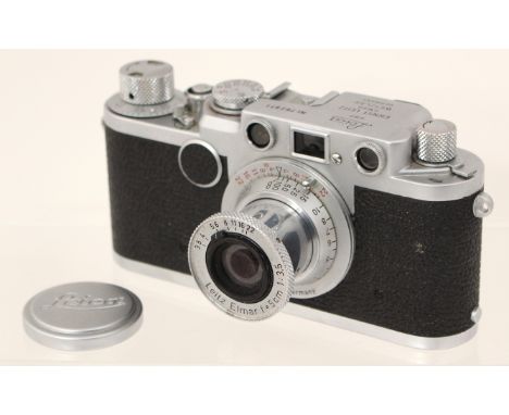 Leica: A Leica IIf camera body, serial number 762971, complete with Leitz Elmar f=5cm 1:3.5 lens and lens cap, together with 