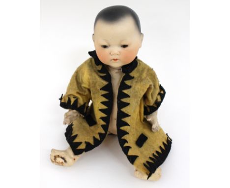 Armand Marseille: A bisque head, Armand Marseille oriental doll, incised 'A.M. Germany 353/2.K', open and close eyes, closed 
