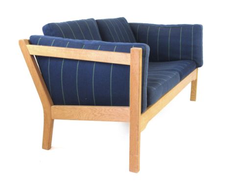 Borge Mogensen for FDB, an oak two seater sofa with blue striped loose cushions   CONDITION REPORT:  Cushions would benefit f