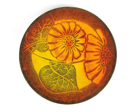 A Poole Aegean pottery charger decorated in a yellow and brown floral glaze, d. 36.5 cm