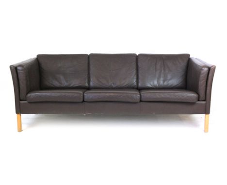 A Danish brown leather three seater sofa on square beech legs