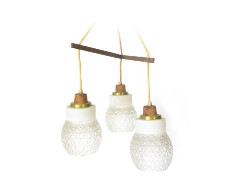A 1970's three spot ceiling light, the three glass shades suspended on a teak Y-form frame