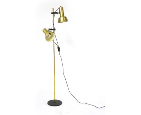 A 1970's brass coloured twin spot standard lamp   CONDITION REPORT:  Dents and knocks, working order unknown