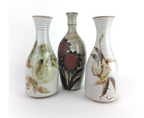 A pair of Briglin pottery vases decorated with autumnal glazes, h. 22 cm, together with a similar vase