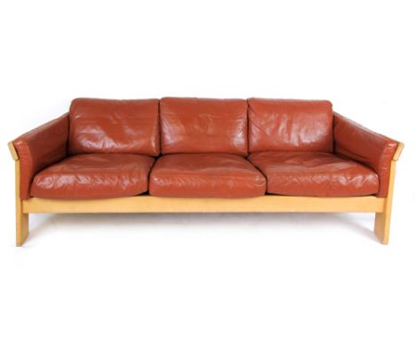 A Danish beech and tan upholstered three seater sofa by Friss   CONDITION REPORT:  Structurally sound but wear and knocks to 