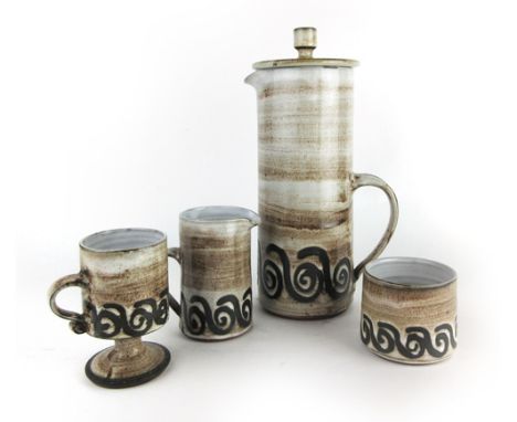 Amended Description: A Briglin pottery four sitting teaset decorated with a grey 'swirl' pattern glaze, together with two fur