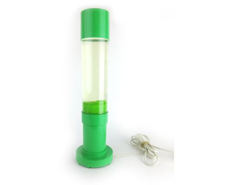 A Mathmos lava-type lamp with a green plastic case