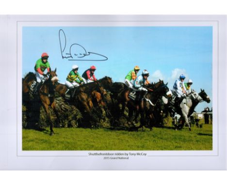 Jockey Tony McCoy Signed 18x12 Colour Print Showing Racehorse Shutthefrontdoor jumping over a hurdle. Signed in black pen. Fa