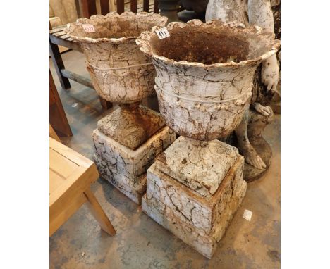 Pair of Georgian cast iron garden urns on plinth bases CONDITION REPORT: H: 60cm including plinth. H: 38cm without plinth. To