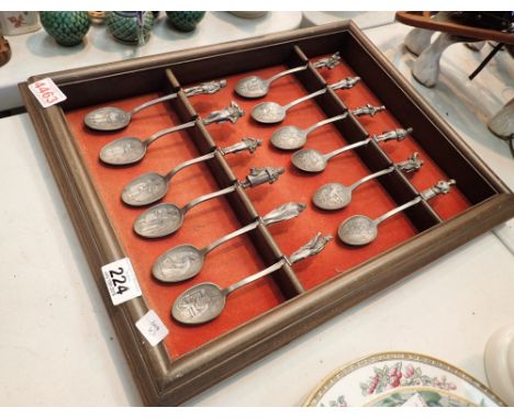 Set of twelve mounted Charles Dickens Christmas Carol pewter spoon sets 