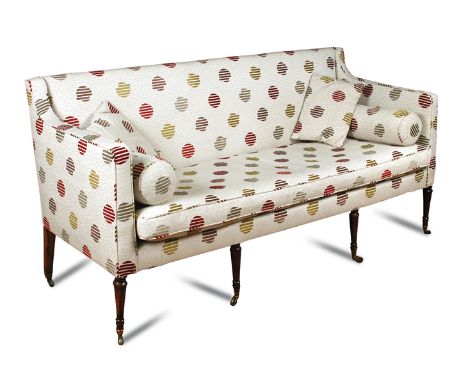 A Regency mahogany framed settee, upholstered in a modern fabric, on slender ring turned legs and casters 90 x 181cm (35 x 71