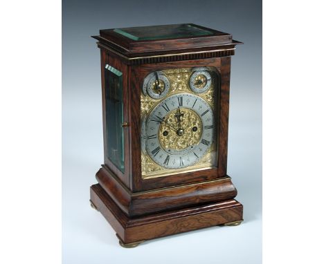 A good 19th century rosewood mantle clock signed Simmons, Coleman Street, London, the bevelled glazed case with foliate gilt 