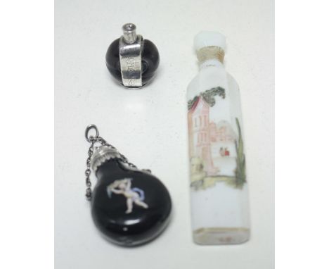 A small silver mounted scent bottle, the body formed from a nut, the unmarked silver mount and collar inscribed 'Wyse' 'Omage