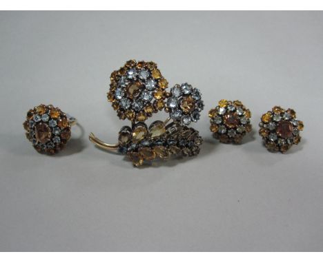 A zircon, citrine and aquamarine floral suite, comprising a spray brooch and flower head ring and earrings, of mid 20th centu
