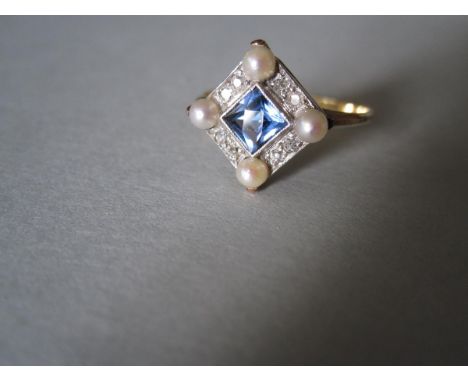 A sapphire, diamond and pearl ring, the square cut light blue sapphire diaper set in a collet, to a border of old single cut 