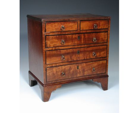 A 19th century miniature mahogany chest of drawers, the rectangular top with reeded edge above two short and three long gradu