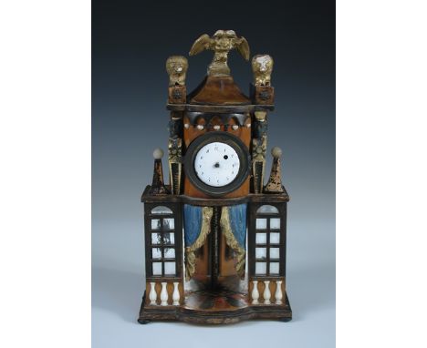A miniature Empire style polychrome decorated 'commode' clock, the case surmounted by a double headed eagle, the mirrored rec