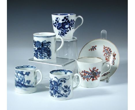 Four 18th century Worcester blue and white coffee cans and another with saucer, the earlier two cans with flowers and the 'Ca