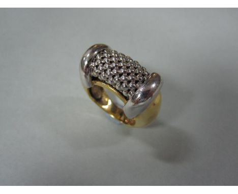 An 18ct gold bi-coloured ring by Salvatore Bersani, the chunky design with a white gold tubular mesh central feature with whi