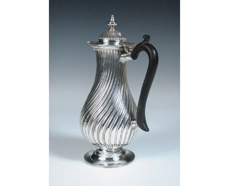 A Victorian silver hotwater jug, by Henry Stratford, London 1895, the baluster body allover wrythen fluted over a plain circu