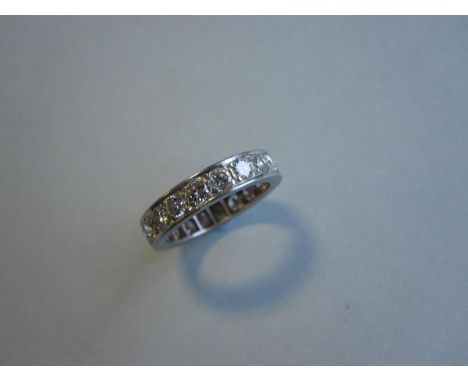 A full hoop diamond eternity ring, set with twenty round brilliant cut diamonds in white precious metal, tests for platinum, 