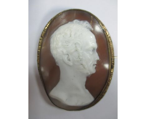 A shell cameo brooch depicting Lord Palmerston after Richard Cockle Lucas, the bust-length profile, collet set in a pinchbeck