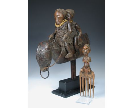 A Bamana Sogo Bo marionette and a Luba, Congo comb, the first with twin figures riding a horse, their arms and legs movable, 