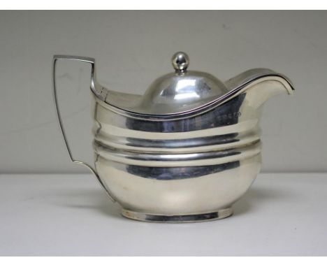 A large George III silver cream jug with cover, by Solomon Hougham, London 1809, of oval shape with broad moulded girdle, flu