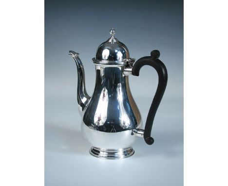 A modern silver coffee pot, by The Barker Ellis Silver Co., Birmingham 1968, of plain baluster form with ebonised scroll hand