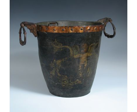 A leather fire bucket and metal liner, the gilt metal rim supporting mask and ring handles, one side painted with an amorini 
