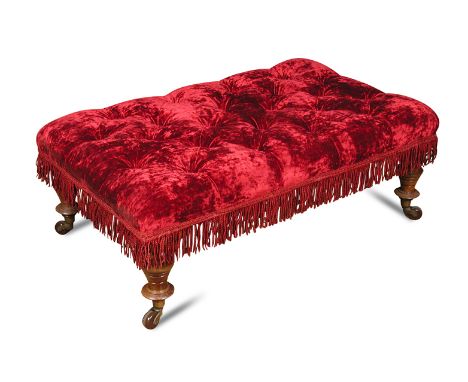A Victorian oak framed stool, button upholstered in a crimson fabric, on turned legs and casters 38 x 102 x 52cm (15 x 40 x 2