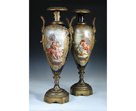 A pair of late 19th century/early 20th century Sevres porcelain vases, painted by Jean Armand with scenes of lovers observed 