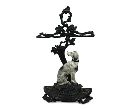 A mid 19th century cast iron stick stand, of a seated hound, inscribed 'Cave Canem' 74 x 44cm (29 x 17in) Evidence of the reg