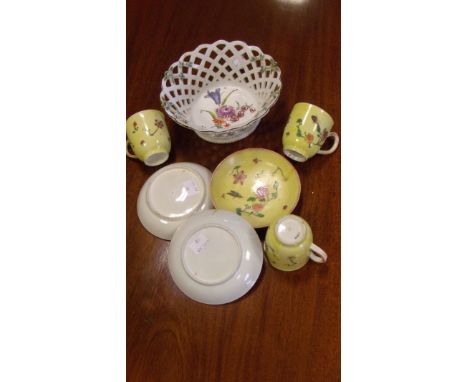 A Chelsea red anchor basket together with three cups and saucers, the centre of the basket painted with a bunch of flowers wi