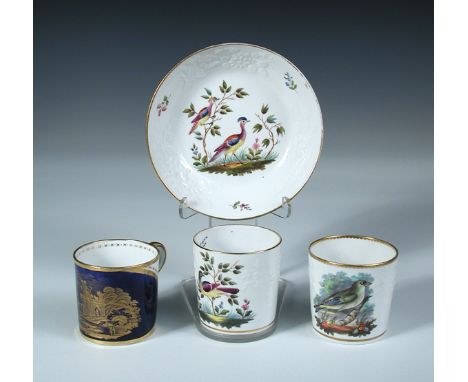 A Spode coffee can and saucer and two other Spode cans, the first painted with pattern number 2099 of exotic birds, a similar