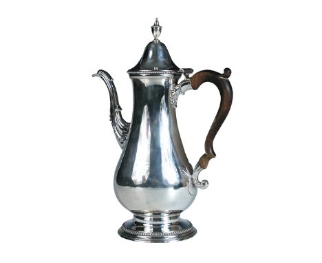 A George III silver coffee pot, probably by Edward Fernell, London 1780, of plain baluster shape with beaded circular foot, b