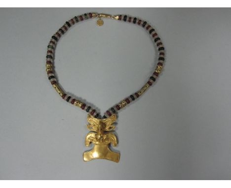A South American gilt and hardstone pendant and bead necklace, the necklace with alternating rondel beads of red jasper, dark